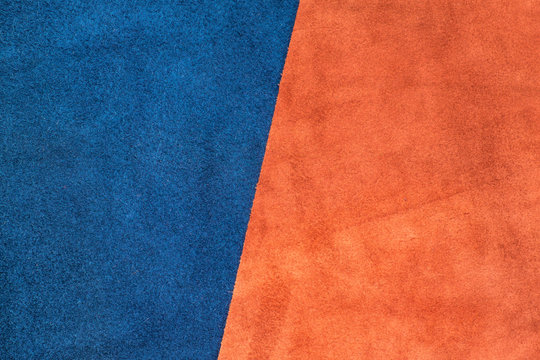 Close up suede navy blue and orange leather divide at half ratio