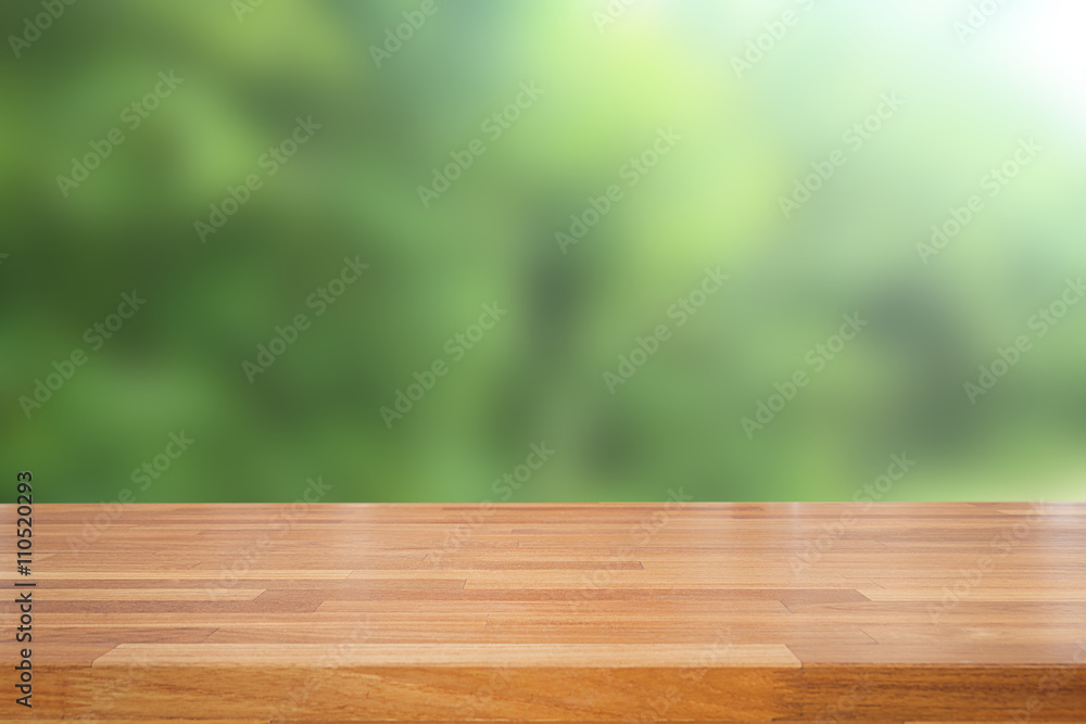 Poster empty wooden table and green natural spring blur bokeh backgroun