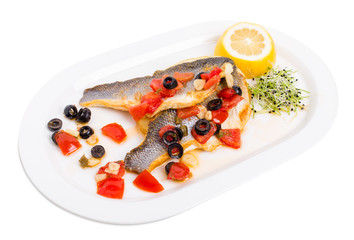 Fillet of seabass on a baked potato.