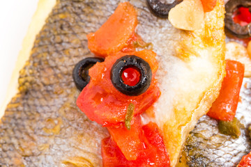 Fillet of seabass with baked vegetables.