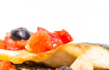 Fillet of seabass with baked vegetables.