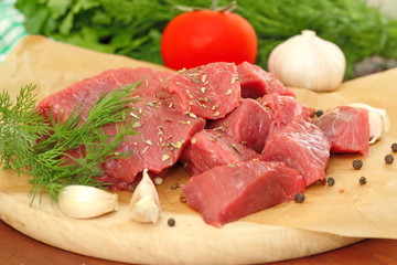 Raw meat with spices and vegetables
