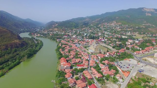 Aerial view of Mtskheta, Georgia. Camera flies on drone above small town.