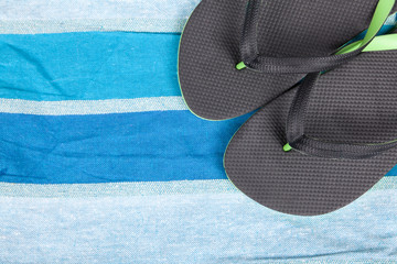 flip-flops on blue color towel background