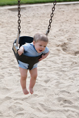 Baby Boy in Swing at Park