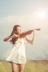 Beautiful women enjoy playing violin