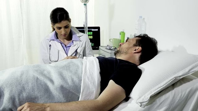 Sad man getting bad news about health in hospital from doctor