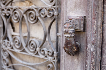 Door knocker in the shape of a hand on an old gate in Hatay, TURKEY