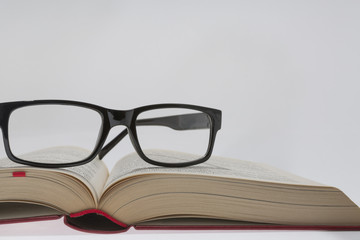 book with reading glasses