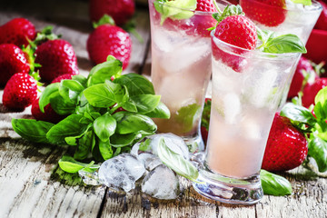 Alcoholic cocktail feeling with Cachaca, cranberry drink, strawb