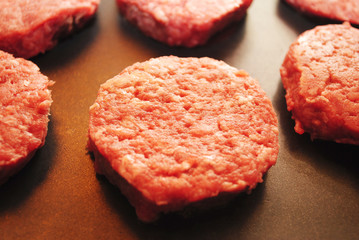 Slider Hamburgers Cooking on a Griddle