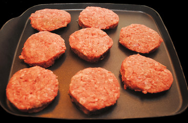 Slider Hamburgers Cooking on a Griddle