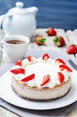 Strawberry cheesecake with fresh strawberries and whipped cream
