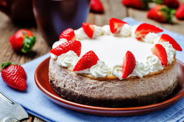 Strawberry cheesecake with fresh strawberries and whipped cream