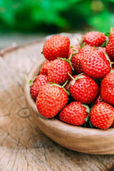 Ripe Strawberry In Fruit Garden, Old Wooden Bowl Filled With Fre
