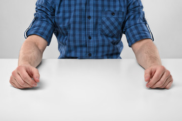 Cropped image of masculine hands at rest. 