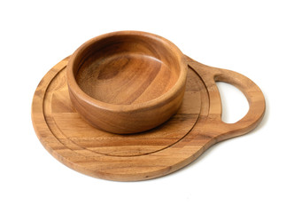 Cutout wooden bowl on a chopping board.