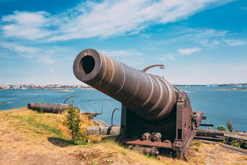 Fototapeta na wymiar Historic Cannon At Suomenlinna, Sveaborg Maritime Fortress In He
