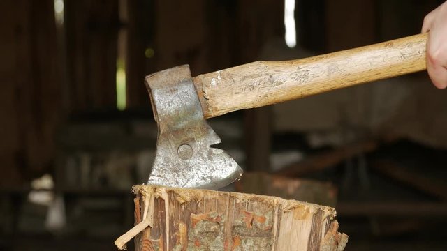 Axe in a stump, close up.