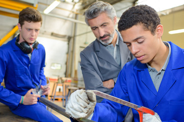 teacher with students in craft class