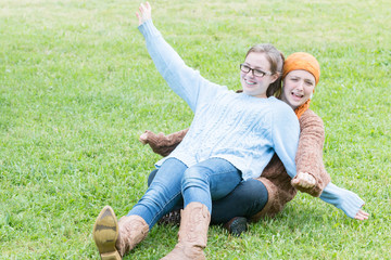 Two Girls Playing on the Grass