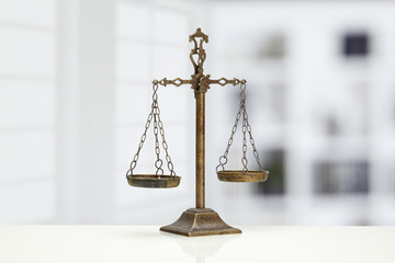 Justice Scale on white table