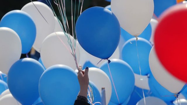 Color helium balloons. Festive balloons fastened together. 4K UHD.