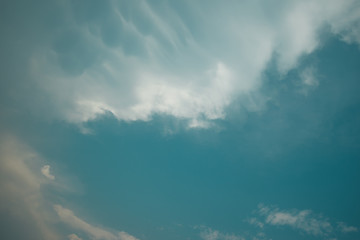 blue sky background with tiny clouds