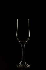 glass with red wine on a black background