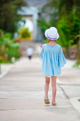 Adorable little girl on tropical beach vacation