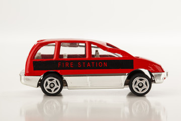 miniature fire vehicles on white background
