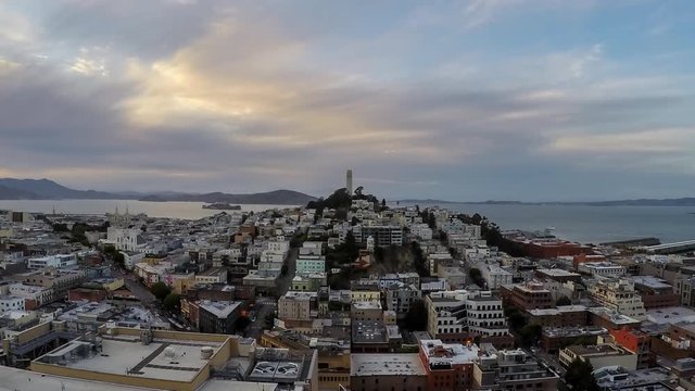San Francisco, California, USA - April 24, 2016:  San Francisco cityscape dusk time lapse with zoom out.