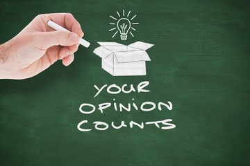 Composite image of hand holding a chalk and writing something