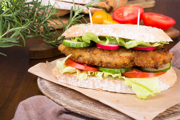 sandwich with fried meat and vegetables
