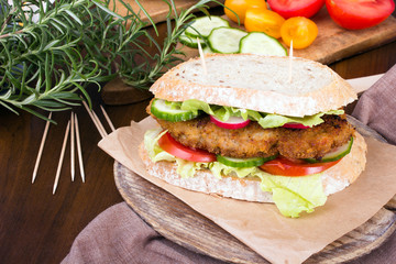 sandwich with fried meat and vegetables