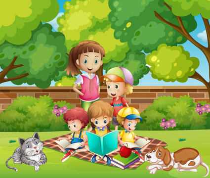 Children reading books in the garden