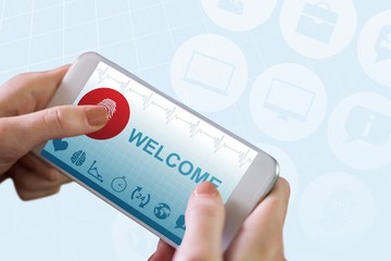 Composite image of hand holding smartphone