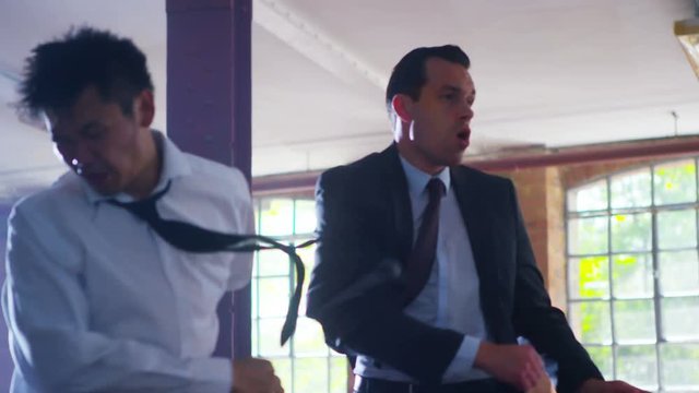  Handsome businessman or special agent character outnumbered in a fight 