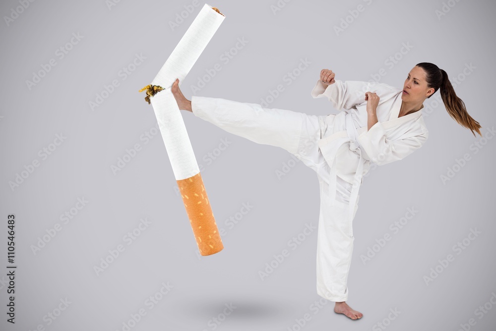 Poster Composite image of fighter performing karate stance