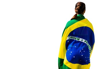 Rear view of sporty woman holding the Brazilian flag