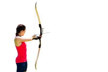 Side view of woman practicing archery