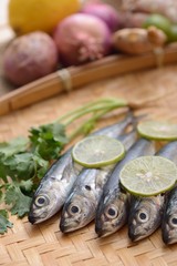 fresh sardine fish in the bamboo basket