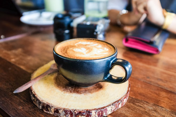 Latte coffee cup on wood table