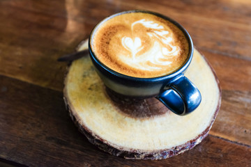 Latte coffee cup on wood table