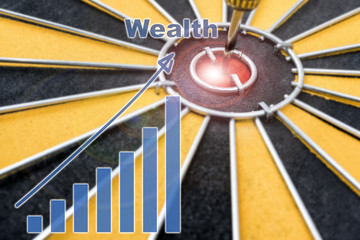 Closeup Wealth Dart target on bullseye with wealth graph, Success business concept, abstract background