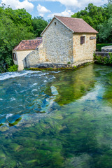 Krka national park, Croatia - May 05, 2016: historic buiding by rapids