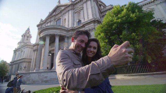  Attractive romantic couple pose to take a selfie outside St. Paul's Cathedral