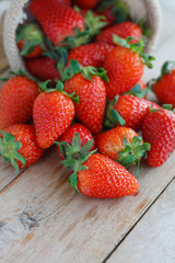 strawberries in small sack on wooden table background