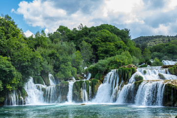 Fototapeta na wymiar Krka national park, Croatia - May 05, 2016: waterfall and rock pool