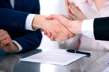 Business people shaking hands finishing up a meeting